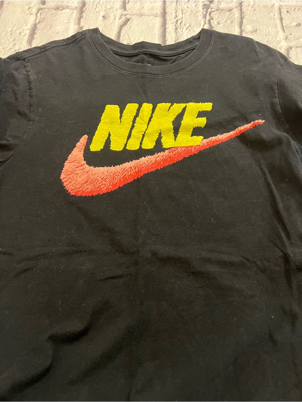 Nike Black T‑Shirt with Yellow Logo and Red Swoosh